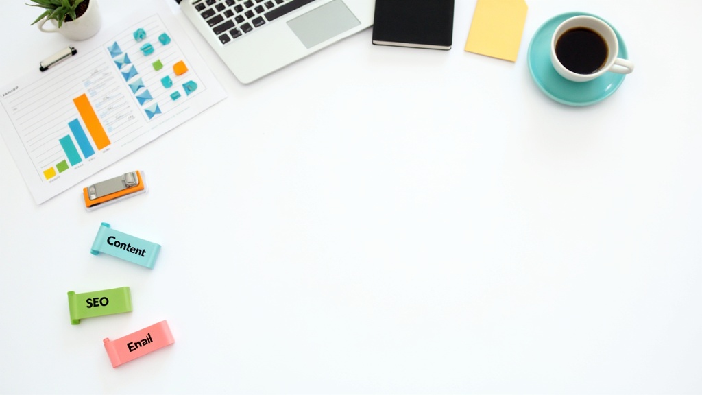 Flat lay showing digital marketing strategy elements on workspace - charts, laptop, notes, coffee